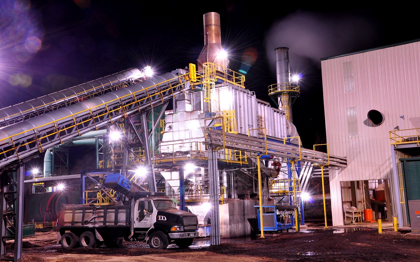 a wood pellet plant at night